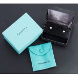 A pair of Tiffany & Co platinum 'Diamonds by the Yard' stud earrings by Elsa Peretti, rub-over