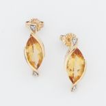 A pair of 9ct yellow gold earrings each set with a marquise shaped citrine and set with two small