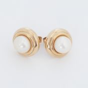 A pair of 9ct yellow gold round stud earrings each set with a white pearl, diameter of earrings