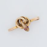 A 9ct yellow gold twisted snake brooch with round red cabochon cut stone eyes, length 3.5cm, 3.84gm,