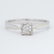 An 18ct white gold ring set with 0.34 carats of round brilliant cut diamond in an illusion