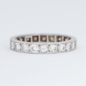 A platinum full eternity ring set with round brilliant cut diamonds, total diamond weight approx.