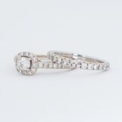 An 18ct white gold ring set with a central round brilliant cut diamond, 0.42 carats, colour H & I1