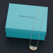 Tiffany & Co, a silver Tiffany & Co 'bean' necklace by Elsa Peretti, the bean is stamped on the