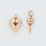 A yellow gold heart charm/pendant set with a round cut ruby, 1.93gm, (possibly 15ct but the hallmark
