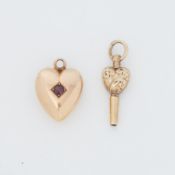 A yellow gold heart charm/pendant set with a round cut ruby, 1.93gm, (possibly 15ct but the hallmark