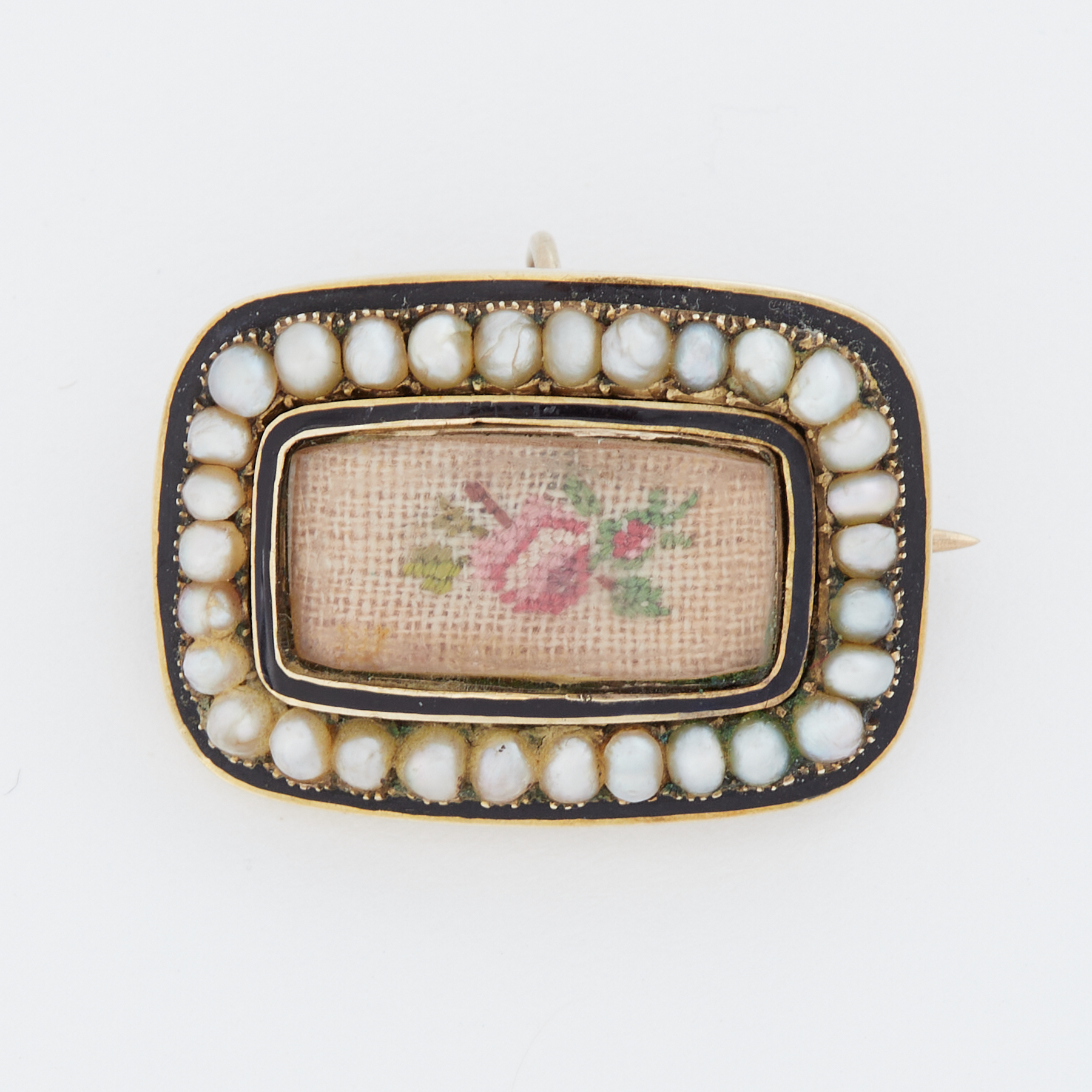 A Georgian yellow gold, black enamel seed pearl & flower tapestry brooch, the tapestry being under a