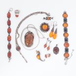 A mixed lot of white metal jewellery set with amber (or amber type stones) to include bracelets,