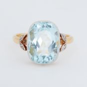 A 22ct yellow & white gold ring set with a central cushion cut aquamarine, approx. 8.00 carats