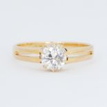 An 18ct yellow gold split shank design ring set with an old round cut diamond, approx. 1.10