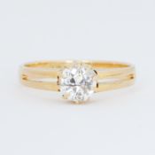 An 18ct yellow gold split shank design ring set with an old round cut diamond, approx. 1.10