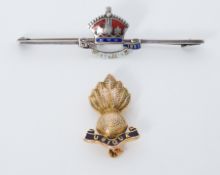 A 9ct yellow gold & black enamel Ubique Military badge, 4.7gm and a silver metal & enamel George V