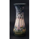 Moorcroft, a tall vase decorated with stylised trees, height 30cm.