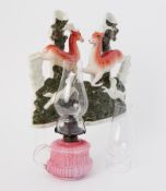 A pair of Staffordshire figures together with a small Victorian chamber glass lamp.