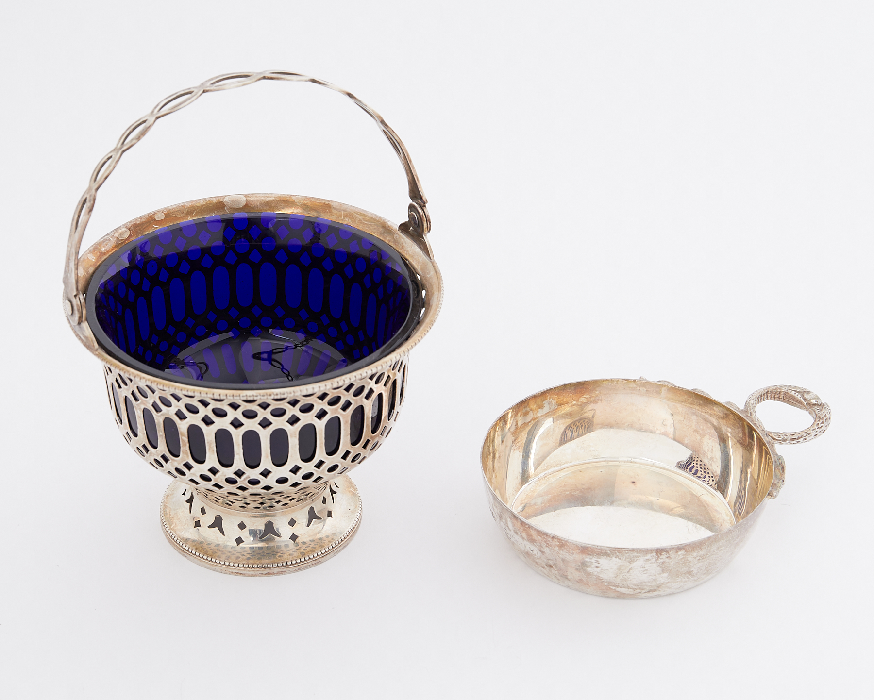 A silver porringer with ornate twisted snake handle, Birmingham, 1998 and a silver sugar basket with