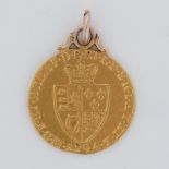 A gold spade Guinea mounted for a pendant, 8.82gm.