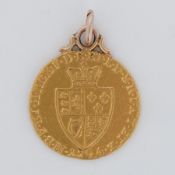 A gold spade Guinea mounted for a pendant, 8.82gm.