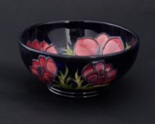 Moorcroft, a bowl marked 94 on blue ground, diameter 16cm.