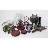 A collection of Oriental replica ornaments including temple jar, dragon figures, metal wares and