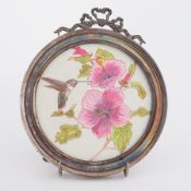 An early 20th century silver circular photo frame with ribbon detail, diameter 16cm.