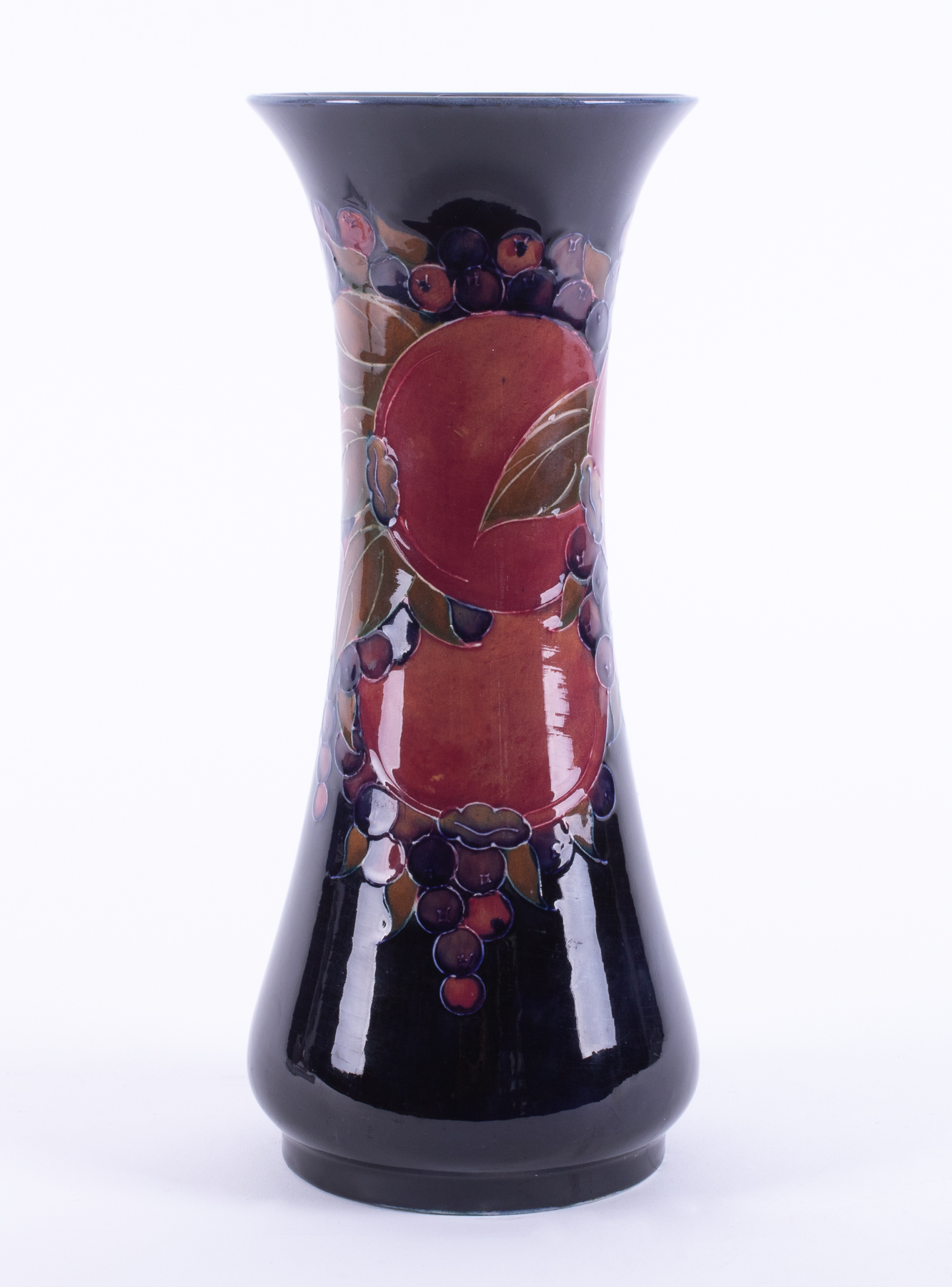 A William Moorcroft Burslem vase decorated with Pomegranate, also decorated on the inside, circa