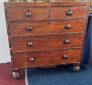 A mahogany chest of drawers fitted with three long drawers and two short, height 94cm, width 89cm.