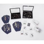 A large quantity of costume & some silver jewellery to include pendants, rings, earrings, etc,