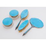 A five piece silver & peacock blue enamel dressing table set to include mirror, two brushes & two