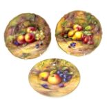 Royal Worcester, three plates decorated with fruit, two signed by N H Price