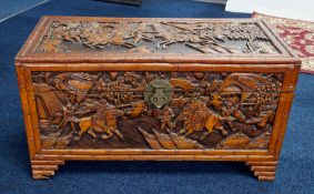 A Chinese carved wood blanket chest, height 52cm, width 94cm.