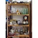 A mixed collection of ornaments, Victorian glass cobb bottles, glass decanters, old lamps, a