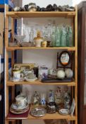 A mixed collection of ornaments, Victorian glass cobb bottles, glass decanters, old lamps, a