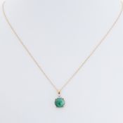 An 18ct yellow gold pendant set with a round cabochon mixed cut natural emerald?, measuring