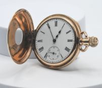 A rolled gold half hunter pocket watch, (hallmarks indistinct as covered).