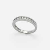A platinum half eternity style ring set with 0.41 carats of round brilliant cut diamonds, 3.93gm,