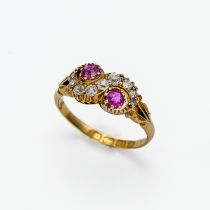 An 18ct diamond and ruby swirl ring, size J.