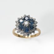 An 18ct yellow & white gold cluster ring set with six round cut sapphires, total sapphire weight