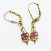 A pair of 9ct yellow gold drop earrings set with a square cut pink sapphire, length approx. 3.3cm,