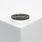 A platinum full eternity ring set with round brilliant cut diamonds, total diamond weight approx.