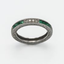 A 14ct white gold diamond and emerald half eternity ring, size N.