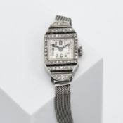 An Art Deco cocktail watch with a platinum case set with diamonds & onyx on an 18ct white gold