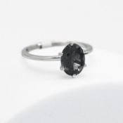 A platinum ring set with 2.10 carats of oval cut teal blue Mahenge Spinel, 3.48gm (weighed with