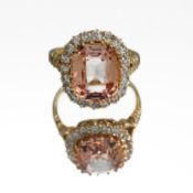 An 18ct yellow gold cluster ring set with a central oval fancy cut orange gemstone, approx. 5.40