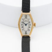 Rolex, an 18ct yellow gold vintage wristwatch, with black arabic numerals and hands, tomeau shaped