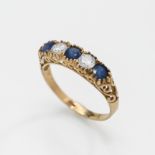 An 18ct yellow gold sapphire and diamond ring, size S.