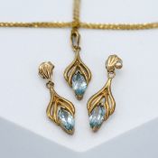 A 9ct yellow gold and pale blue topaz drop earrings together with 9act yellow gold and pale blue