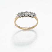 An 18ct yellow gold & platinum five stone ring set with five round cut diamonds, 1.71gm, size L 1/