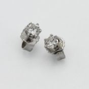 A pair of diamond studs approx 0.20ct on 14ct white gold butterfly clasps.