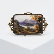 A 19th century gold brooch, the rectangular plaque painted depicting an alpine & lake landscape,