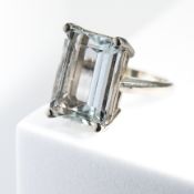 A white gold ring set with a large rectangular cut aquamarine, approx. 16.30 carats, 10.31gm, size M